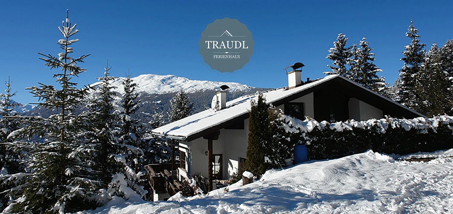 Ferienhaus Traudl im Winter – verschneites Holzhaus mit Balkonen in Kaitanger bei Jerzens am Hochzeiger